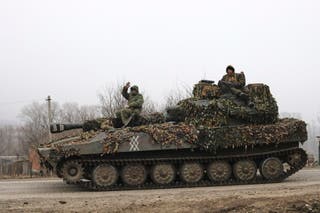 Russian soldiers riding on a self-propelled gun in the Russian region Kursk